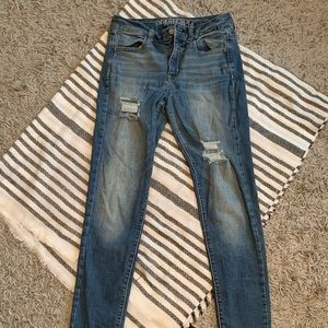 American Eagle Medium Wash High Rise Super Stretch Size 4
